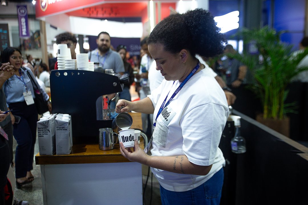 A barista pouring coffee at the Nude stand, Rio Innovation Week