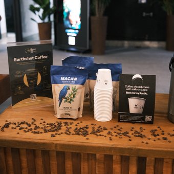 Macaw coffee bags and Notpla cups displayed at Earthshot