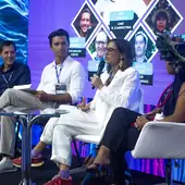 Bel Coelho speaking on the panel